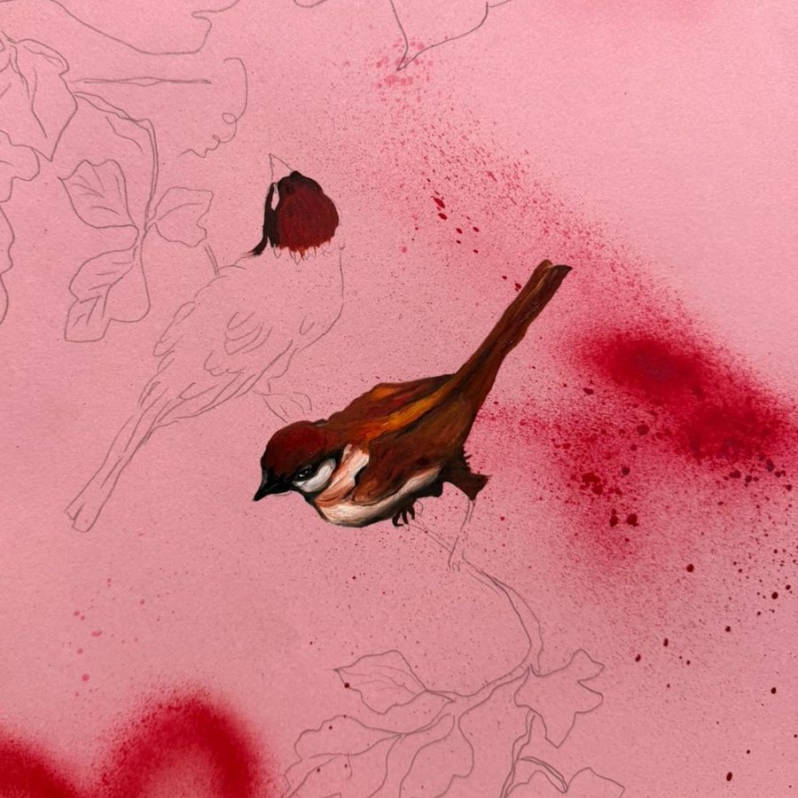 Close-up of a sparrow painted on pink paper beside pencil outlines of leaves